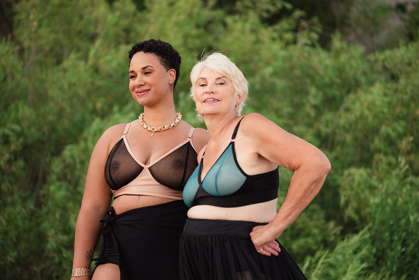 Two women of different ages (30+ and 50+) wearing custom bespoke sheer bras from Rubies Bras