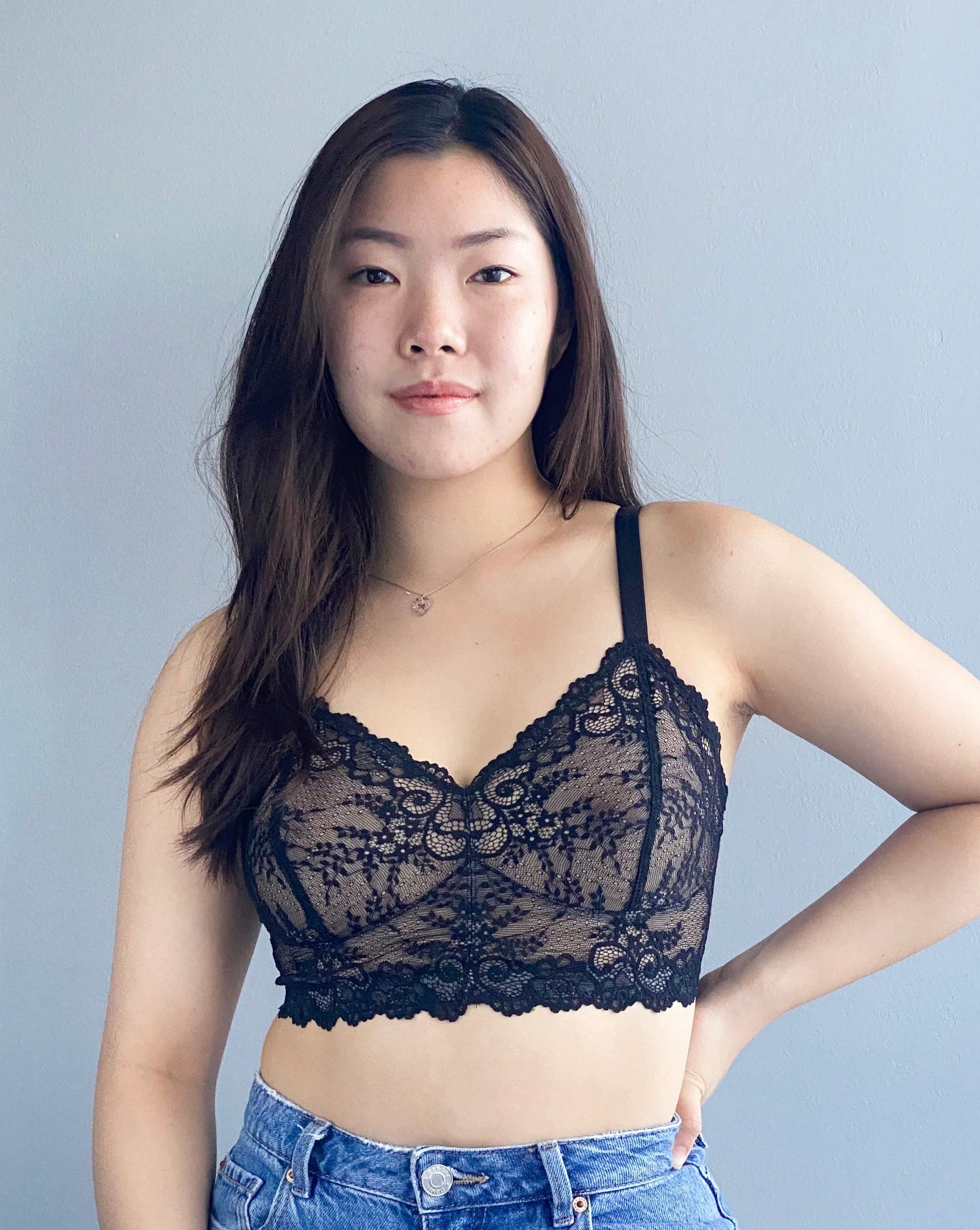 Model with long dark brown hair wearing a black lace Viva Scalloped wirefree Bra from Rubies Custom Bras.