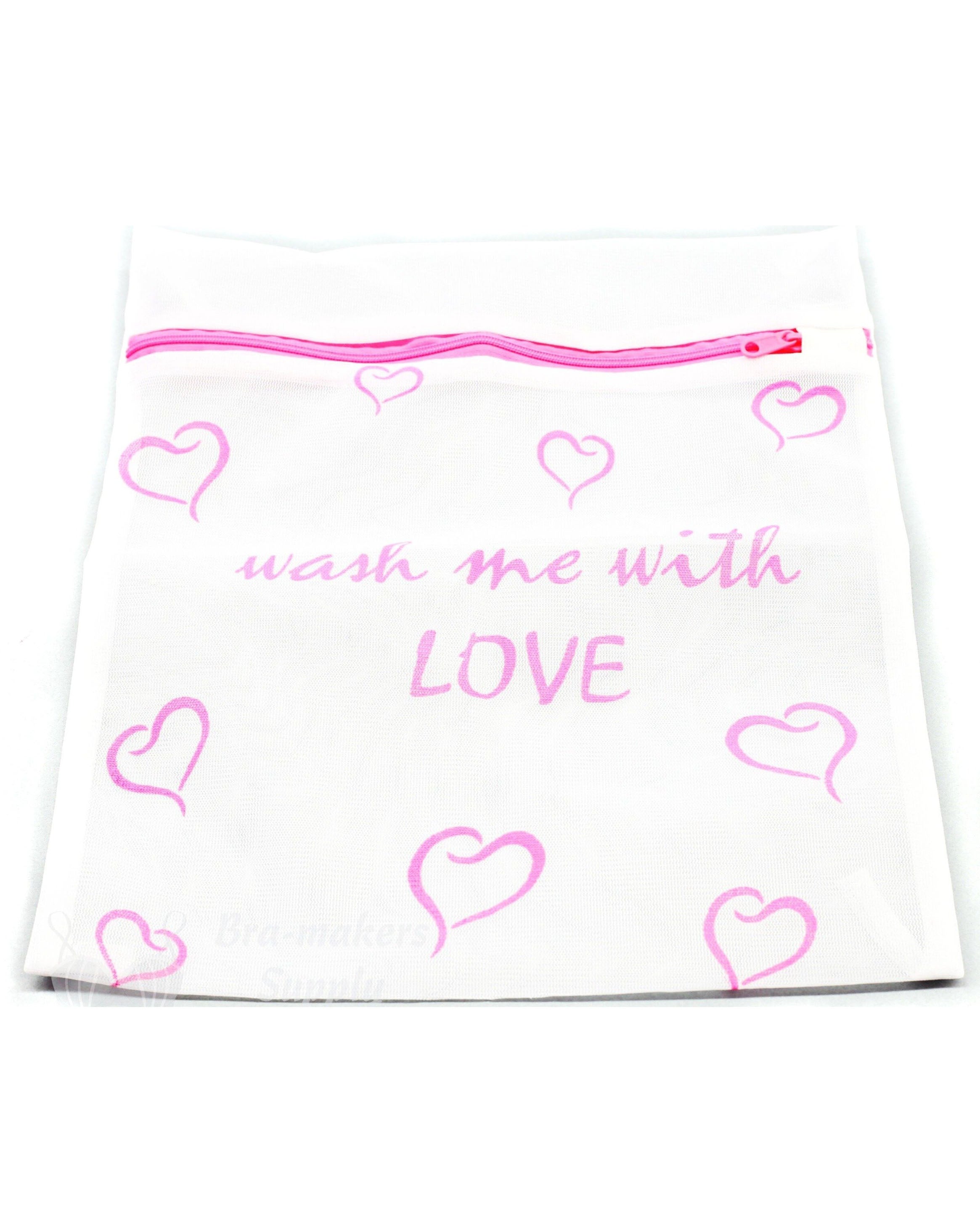 pink hearts on white lingerie wash bag. Contains text "wash me with love"."