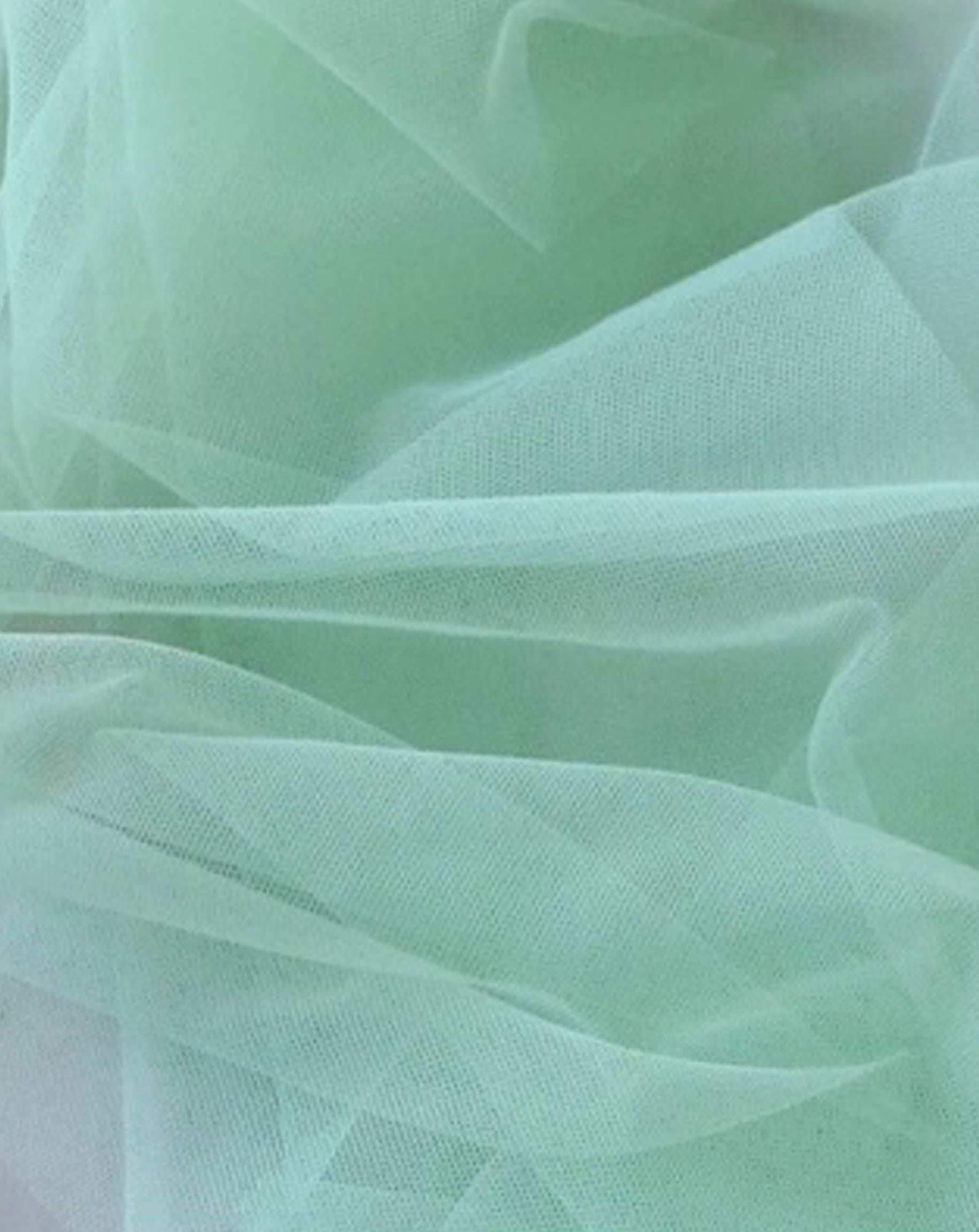 Close up of Rubies Bras mint tulle fabric.