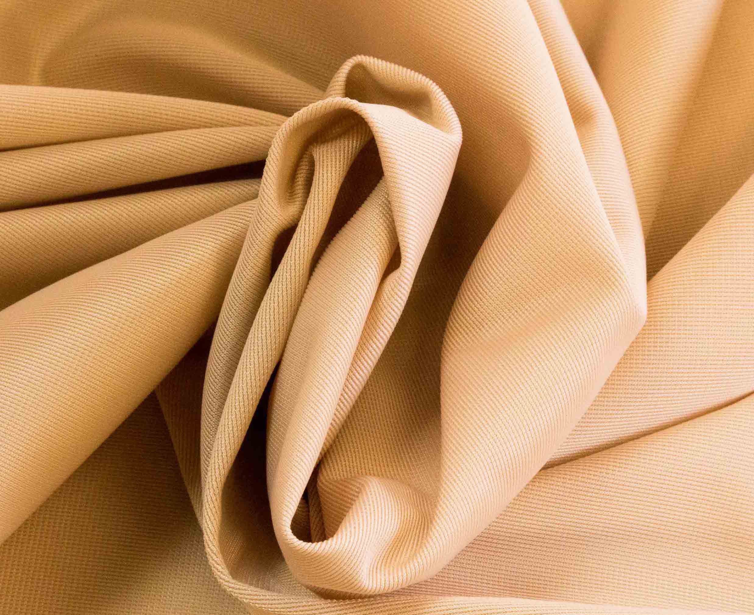 Rubies Bras Stretch Satin fabric in beige. Close up.