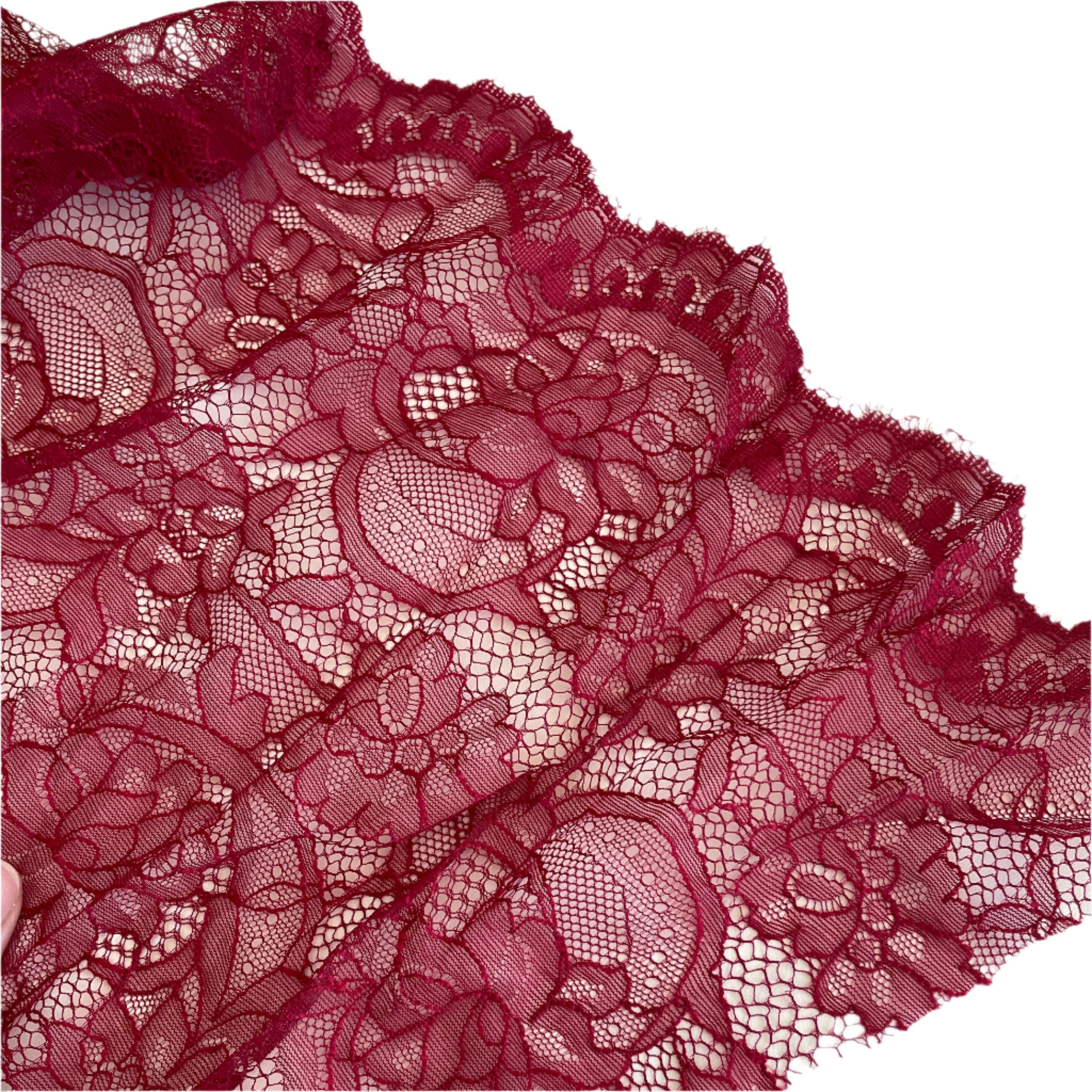 Close up of lace in the color black cherry from Rubies Custom Bras. Our fabrics are long lasting and high quality. Book a online fitting appointment to have a custom bra made today. A custom bra is worth the price because it is custom made to fit and made to last years.