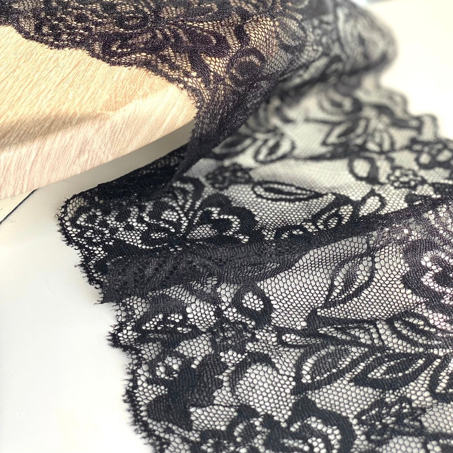 Close up of lace in the color black from Rubies Custom Bras. Our fabrics are long lasting and high quality. Book a online fitting appointment to have a custom bra made today. A custom bra is worth the price because it is custom made to fit and made to last years.