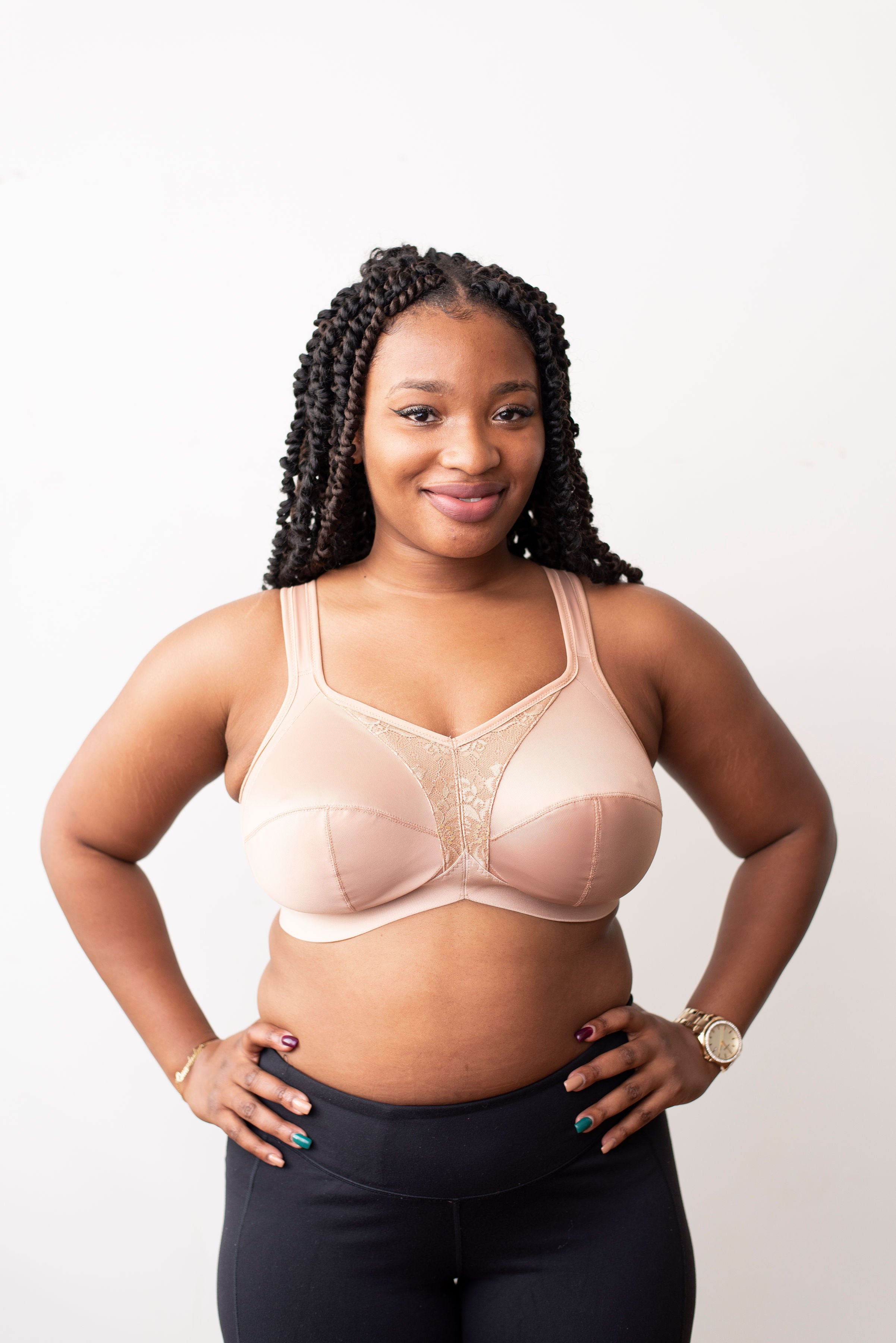 Model with black braids wearing a beige mastectomy bra. Made with low stretch and wide elastics for comfort and support. Can add your own prosthesis or we can sew them in. 