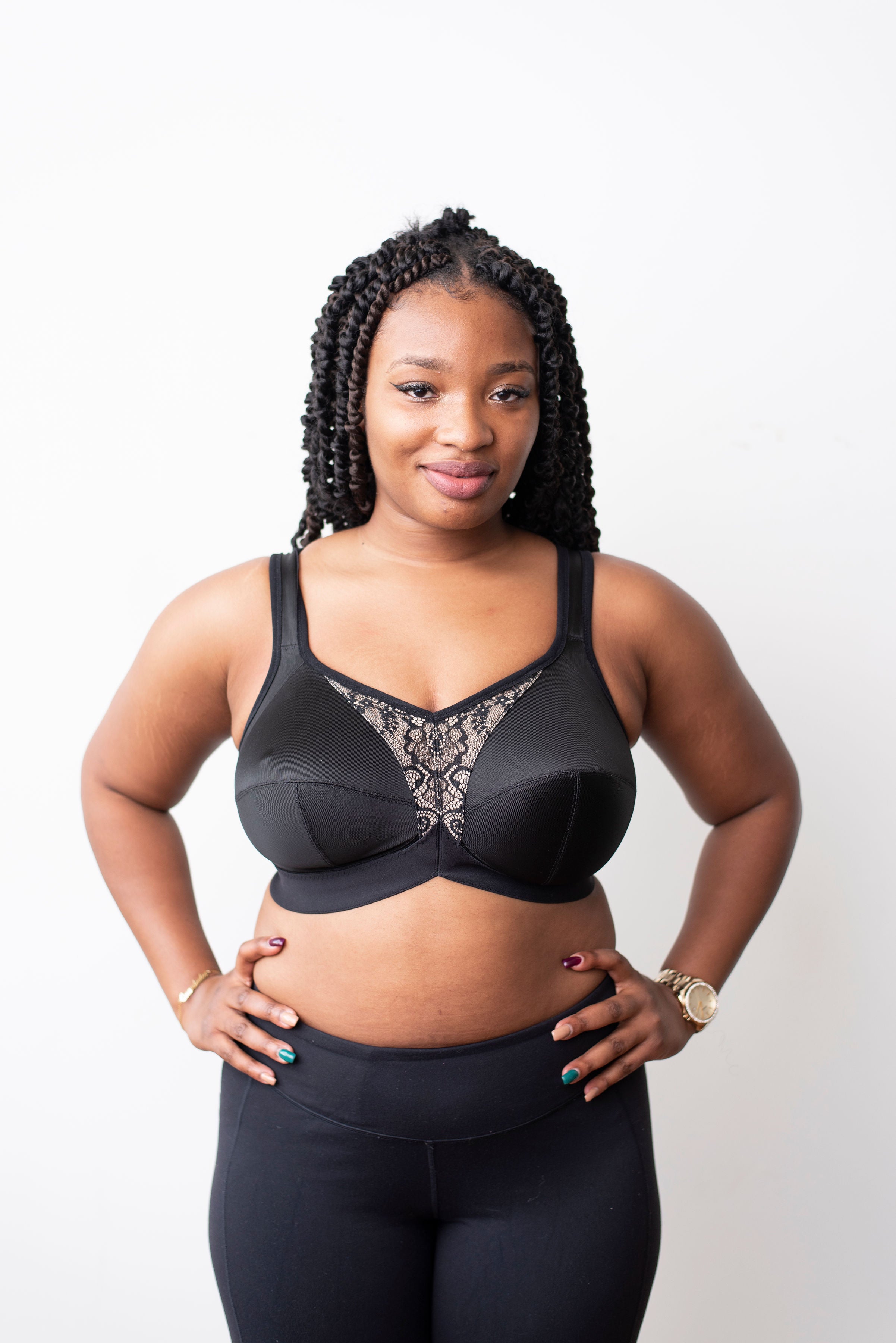 Model with black braids wearing a black mastectomy bra. Made with low stretch and wide elastics for comfort and support. Can add your own prosthesis or we can sew them in. 