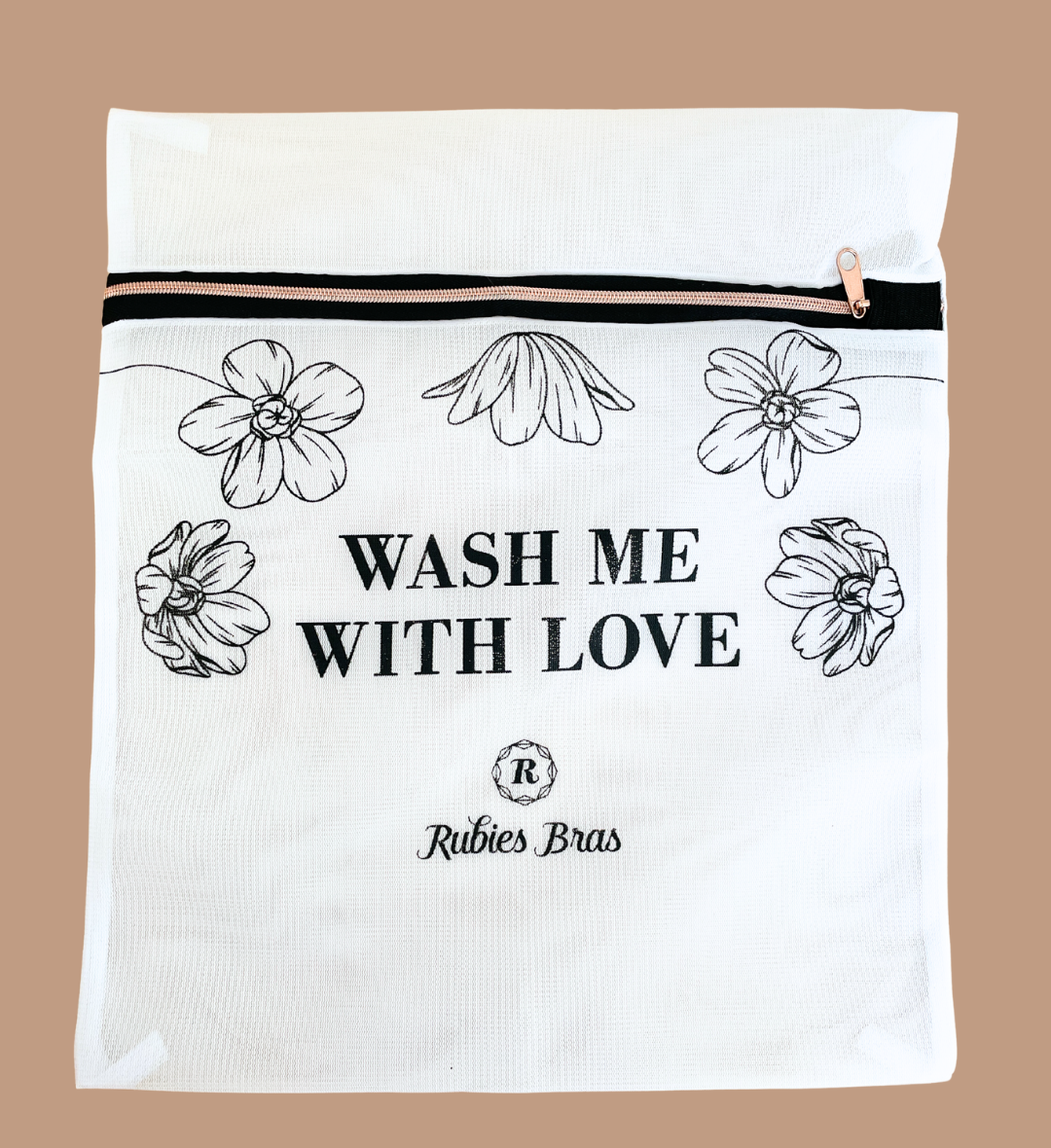 White cloth wash bag with flowers and gold zipper. Contains black text: Wash me with love and the Rubies Bras logo. 
