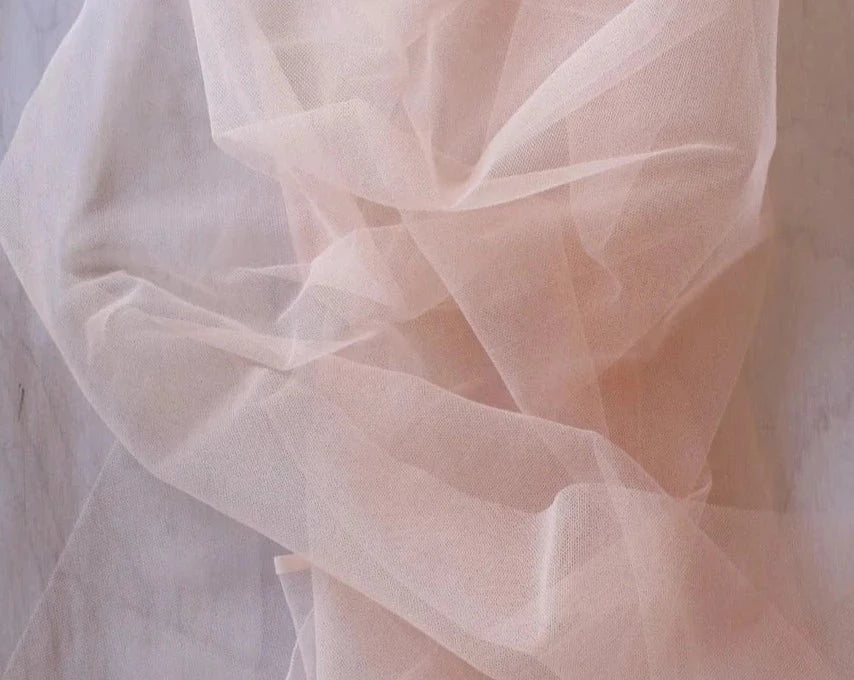 Close up of Rubies Bras blush pink tulle fabric.