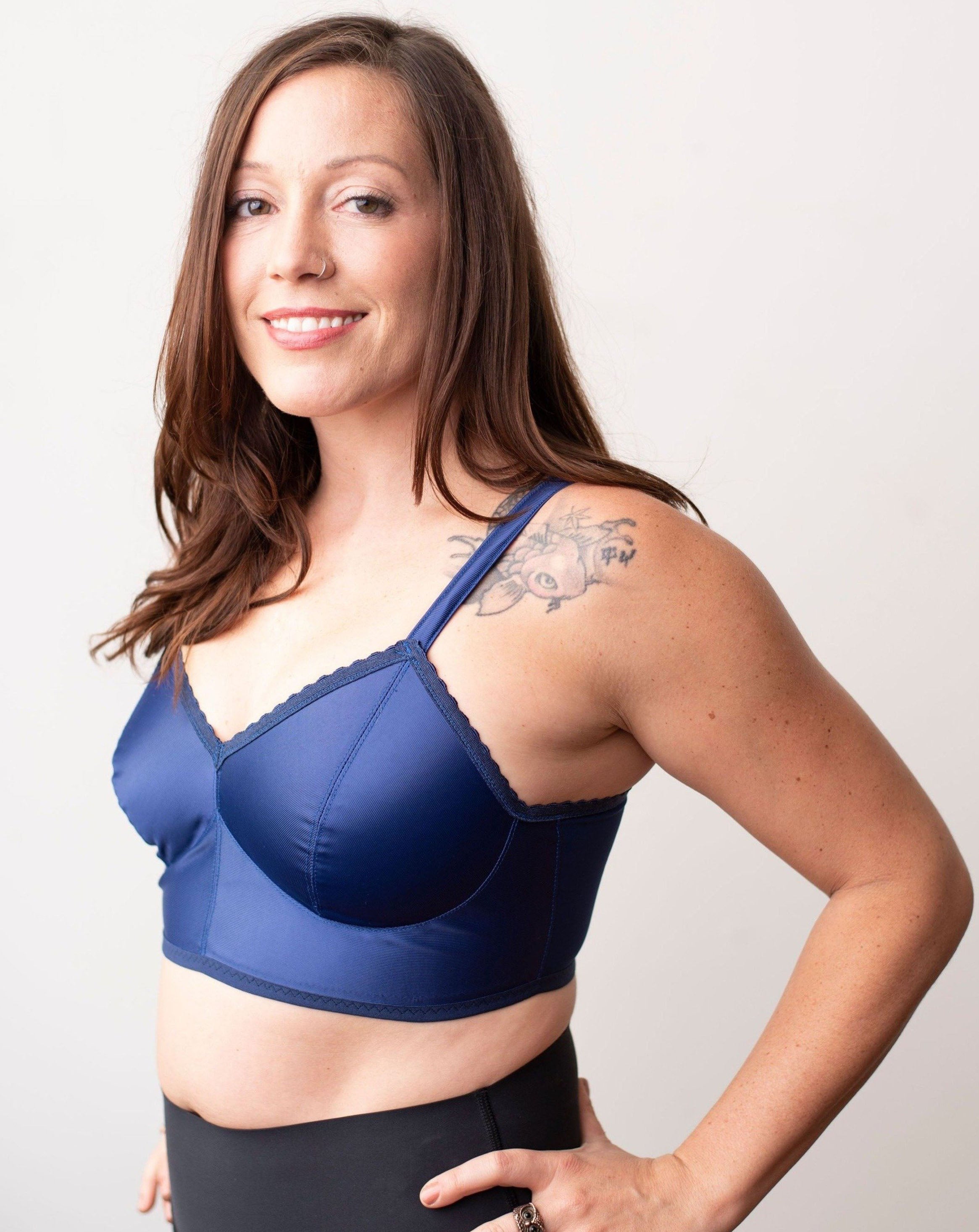 Brown hair model wearing a navy blue solid bra from Rubies Custom Bras.