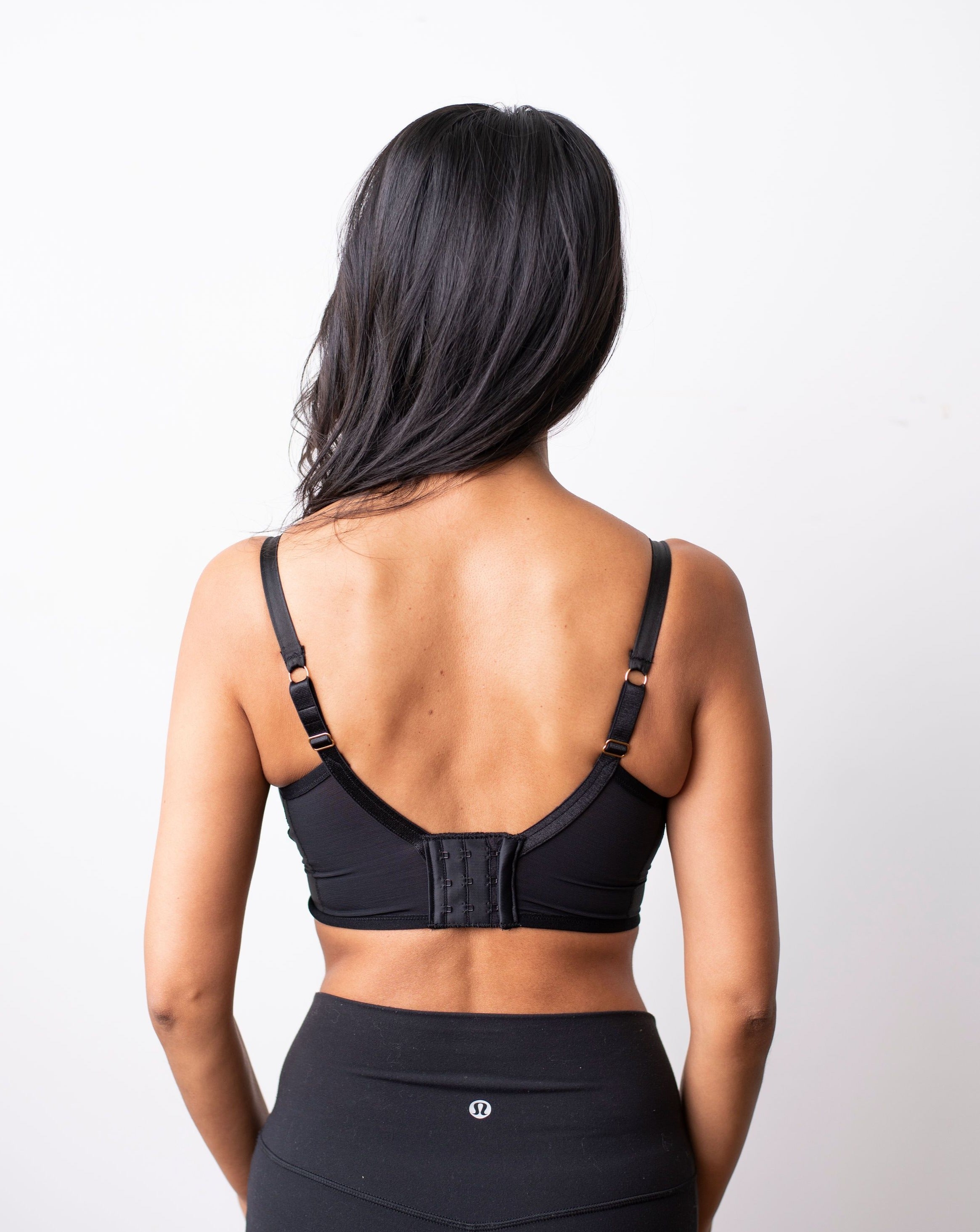 Back shot of the sheer, wire free, black bra. Shot against a white background.