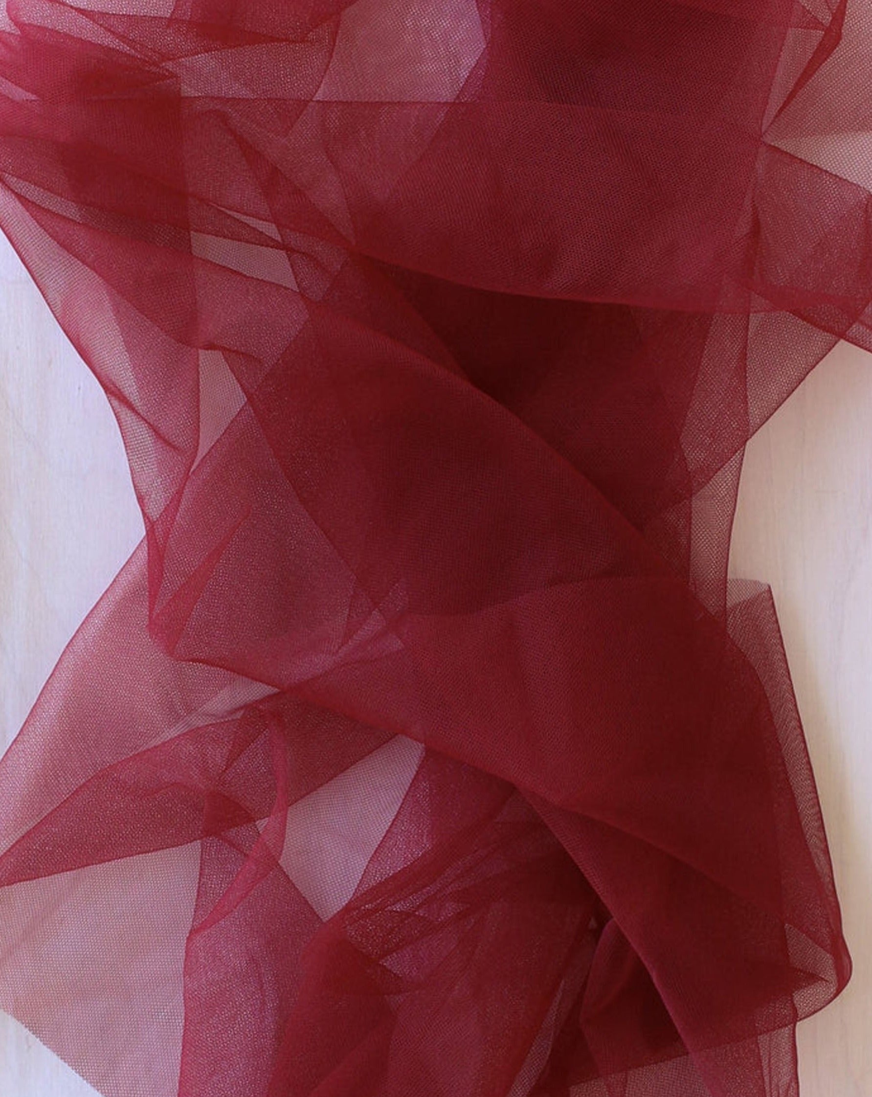Close up of Rubies Bras black cherry tulle fabric.
