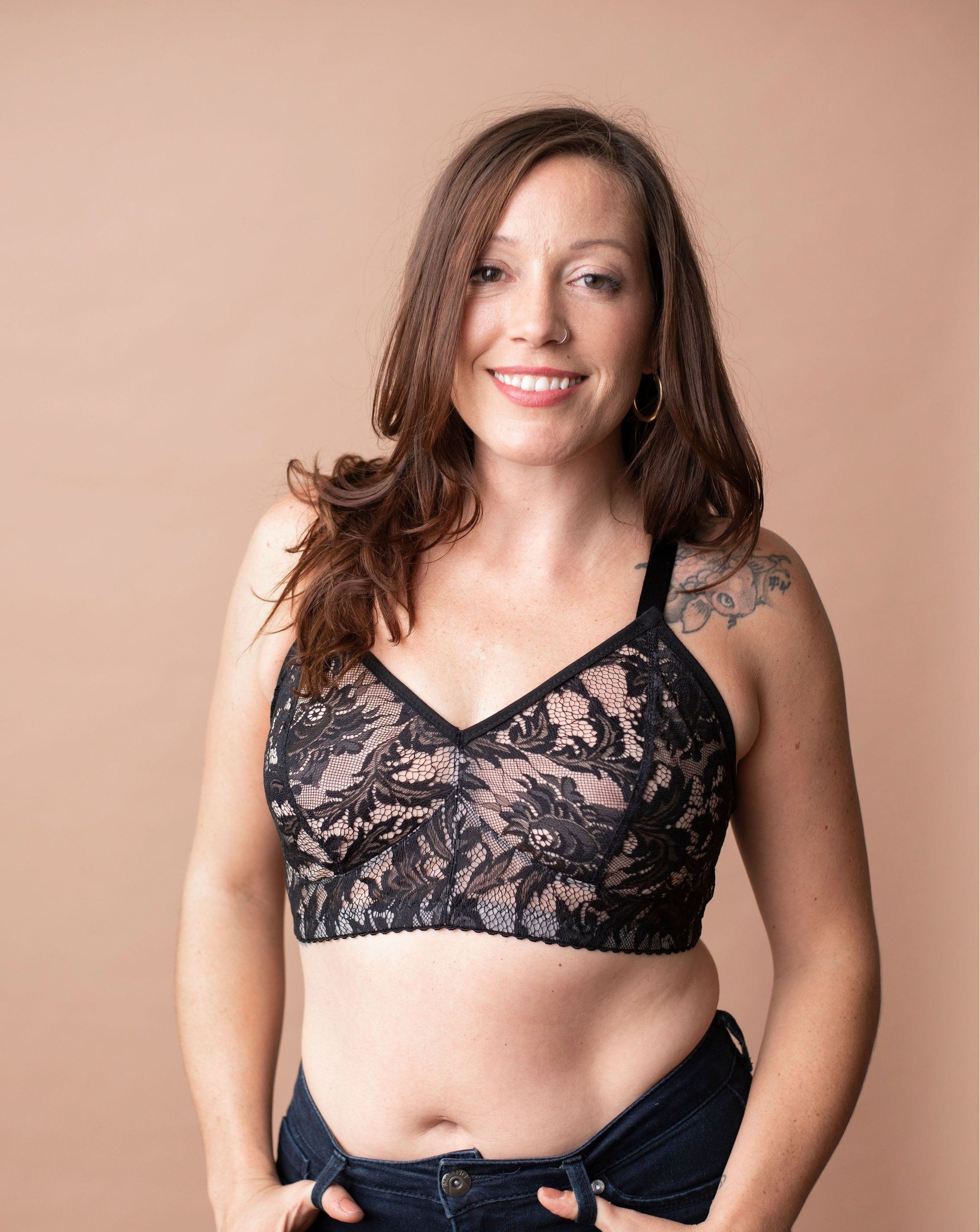 Model in Rubies Chantilly lace bra on a brown background.