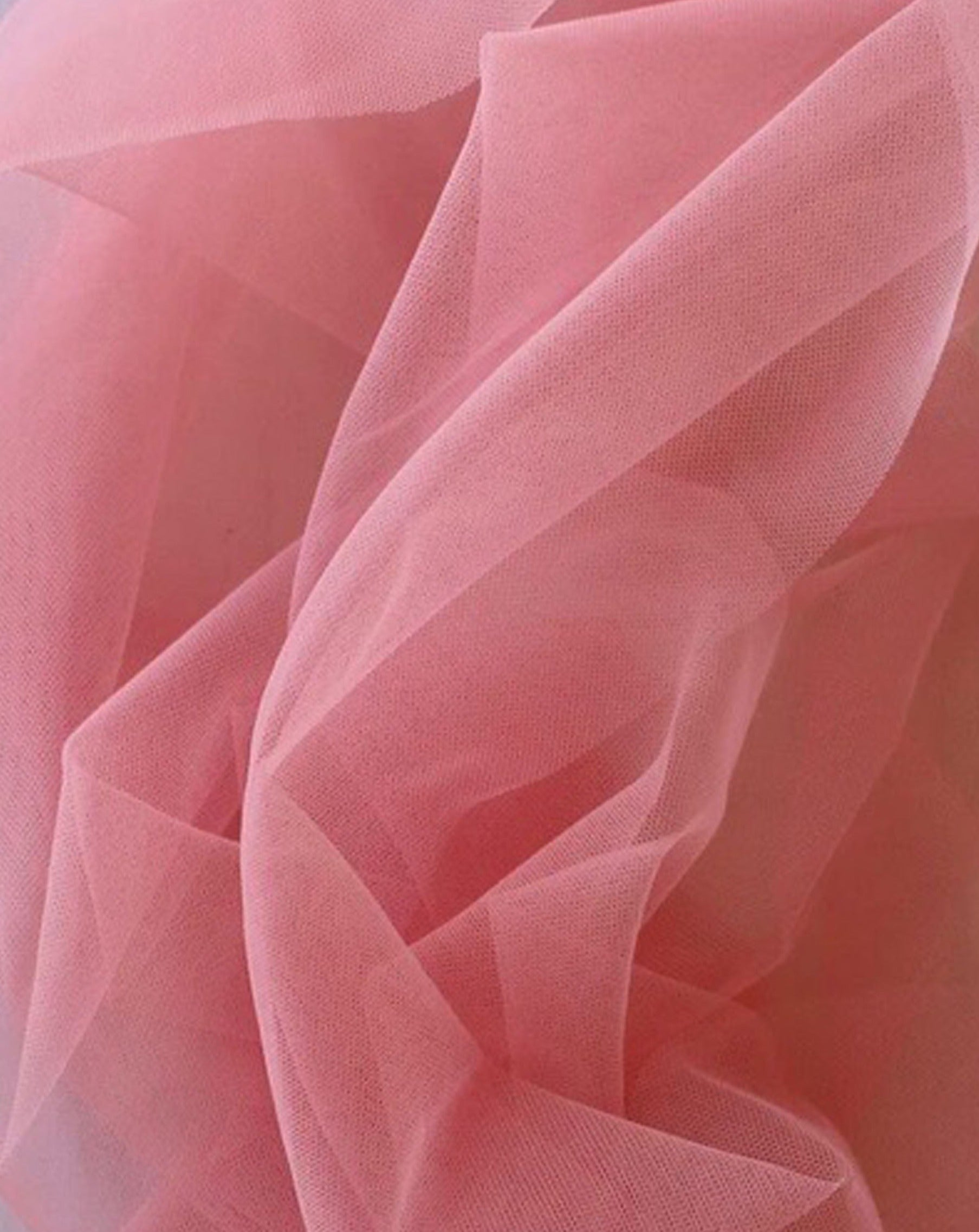 Close up of Rubies Bras pink tulle fabric.