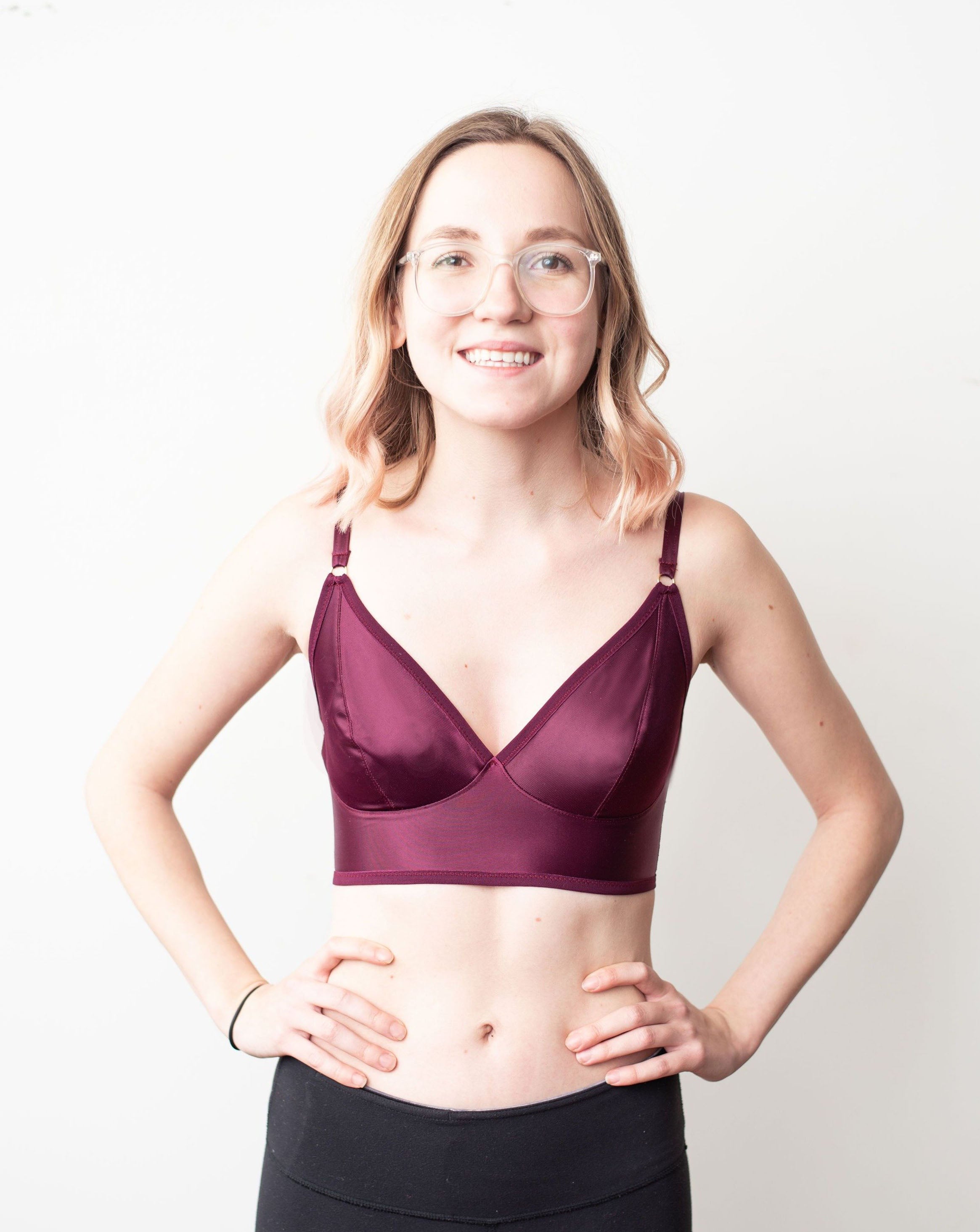 Front shot of light skinned model with blonde hair wearing a black cherry minimal solids bra.